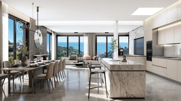 Modern sea-view villa kitchen and dining area with marble island, open plan layout, and panoramic views.